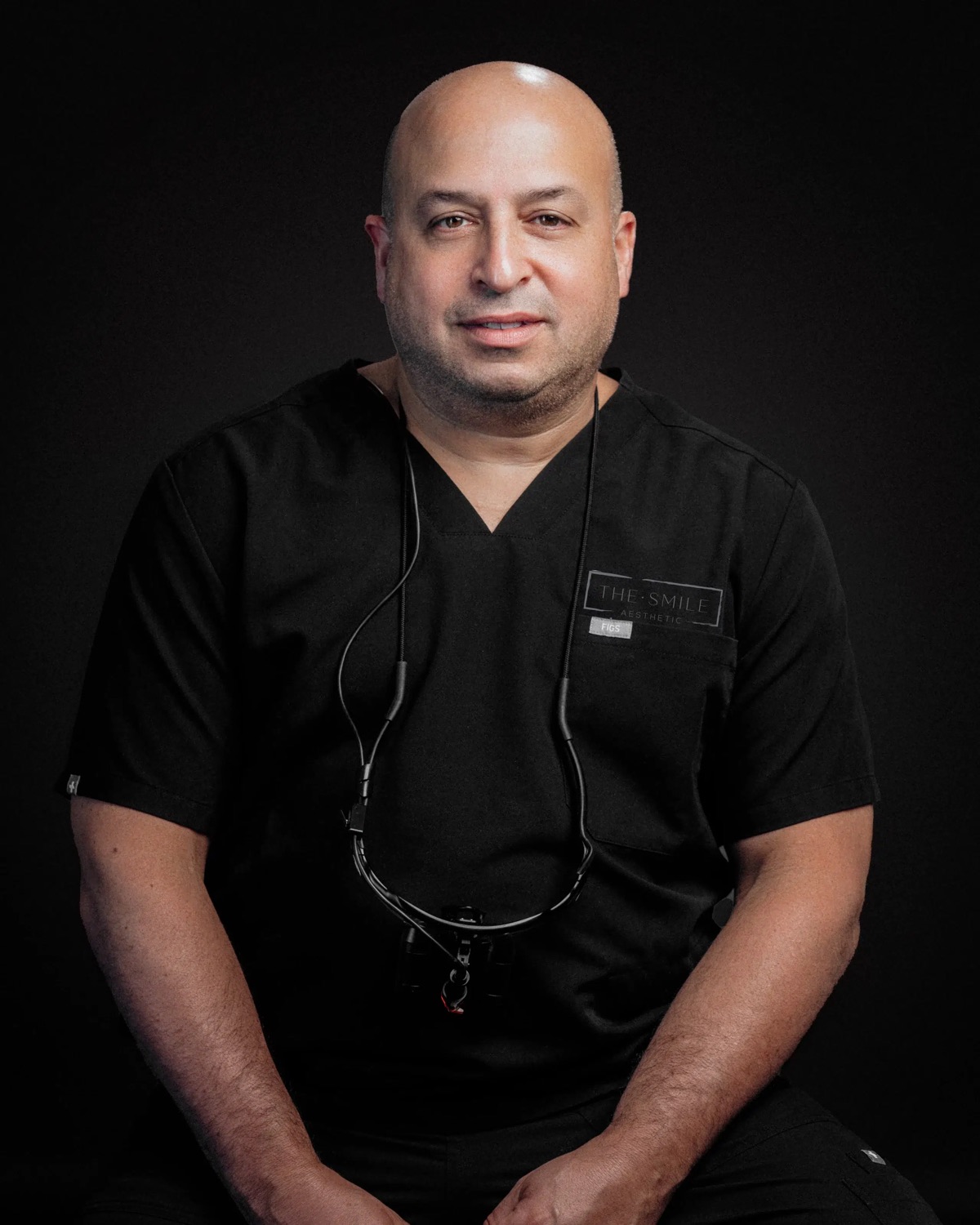 Dr. Todd Goldstein, DDS, in black scrubs